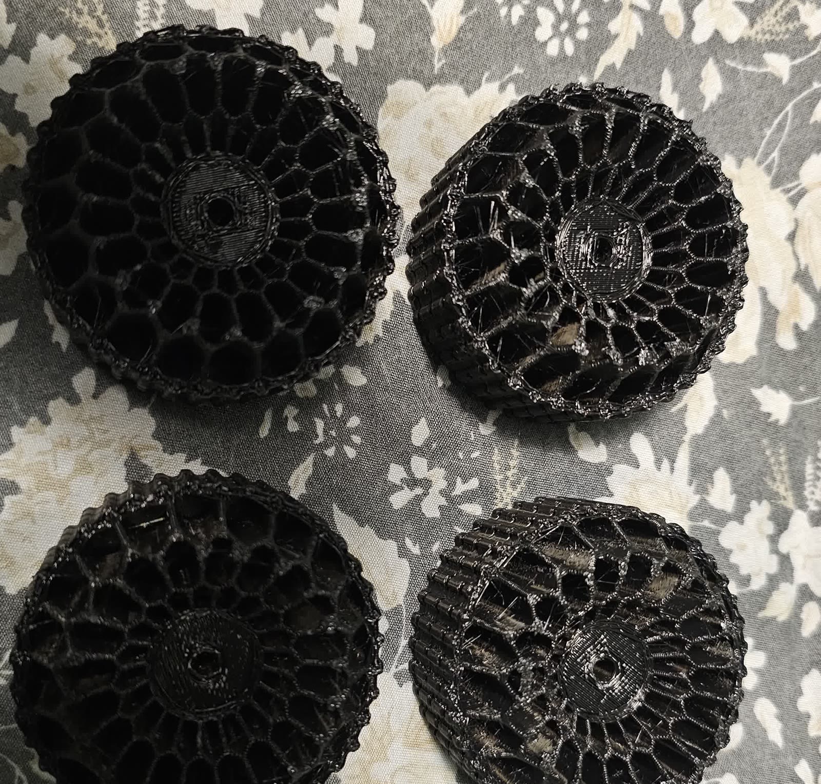 Four 3D-printed lattice-tread tire prototypes